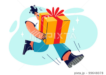 Running man holds huge gift box to wish girlfriend or friend happy birthday or other holiday Running man holds huge gift box to wish girlfriend or friend happy birthday or other holiday 99648078