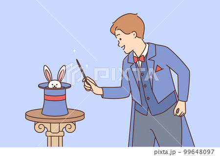 Man magician stands near hat in which rabbit is hiding in preparation for stunt 99648097