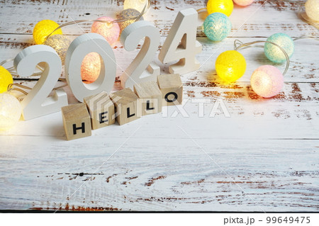 Hello 2024 word alphabet letters on wooden background 99649475