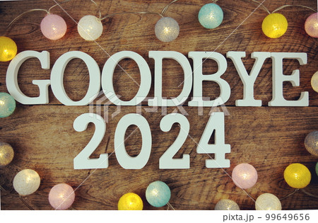 Goodbye 2024 alphabet letters and LED cotton ball decoration on wooden background Goodbye 2024 alphabet letters and LED cotton ball decoration on wooden background 99649656