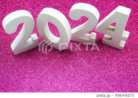 Happy New year 2024 with space copy on pink glitter background Happy New year 2024 with space copy on pink glitter background 99649875