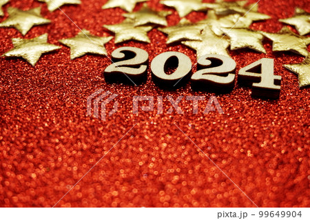 Happy New year 2024 with space copy on red glitter background Happy New year 2024 with space copy on red glitter background 99649904