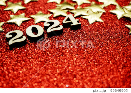 Happy New year 2024 with space copy on red glitter background Happy New year 2024 with space copy on red glitter background 99649905