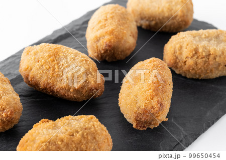 Traditional spanish fried croquettes isolated on white bckground Traditional spanish fried croquettes isolated on white bckground 99650454