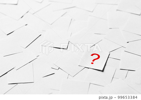 Pile of blank pieces of paper with red question mark in the middle Pile of blank pieces of paper with red question mark in the middle 99653384
