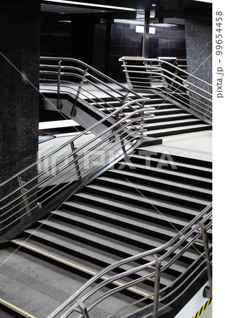 stairs with steel railings in underground passage stairs with steel railings in underground passage 99654458