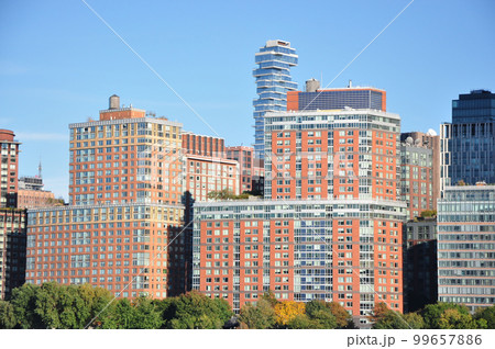 Scenic view of 56 Leonard Street skyscraper behind classic houses in New York Scenic view of 56 Leonard Street skyscraper behind classic houses in New York 99657886