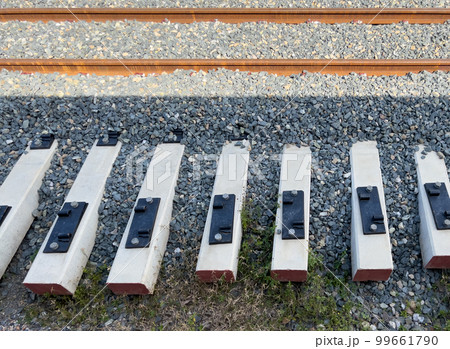 The new railway sleepers are laid beside the railway. The new railway sleepers are laid beside the railway. 99661790