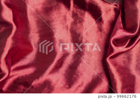 Smooth elegant burgundy silk or satin luxury fabric texture Top view 99662176