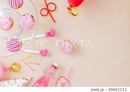 Preparing for birthday party. Attributes of holiday on pink background. Top view. Copy space Preparing for birthday party. Attributes of holiday on pink background. Top view. Copy space 99662522
