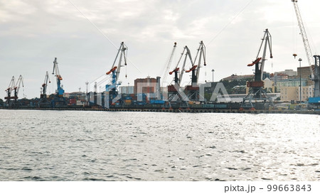 The seaport of Vladivostok with cranes. View from the ferry. 99663843