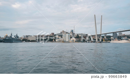Panorama of the Russian city of Vladivstok. View from the moving ferry. Panorama of the Russian city of Vladivstok. View from the moving ferry. 99663849
