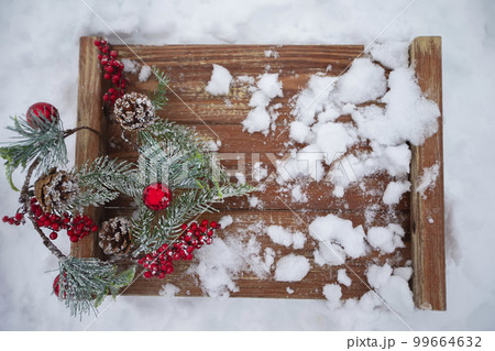 The texture of an old tree with a snowy Christmas background, fir branches and cones. The texture of an old tree with a snowy Christmas background, fir branches and cones. 99664632