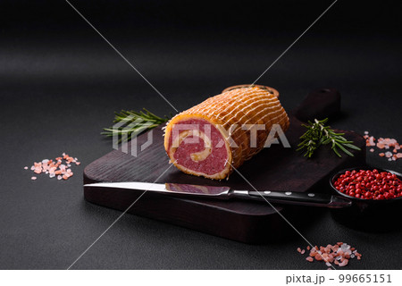 Delicious roll with meat, cheese, mushrooms, spices and herbs Delicious roll with meat, cheese, mushrooms, spices and herbs 99665151