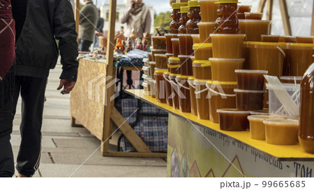 jars of flower honey are placed in a row, soft focus jars of flower honey are placed in a row, soft focus 99665685