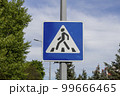 Blue and white pedestrian crossing sign 99666465