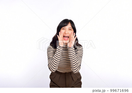 Happy young asian woman, professional entrepreneur standing in casual clothing, open mouths raising hands shout announcement, white background Happy young asian woman, professional entrepreneur standing in casual clothing, open mouths raising hands shout announcement, white background 99671696