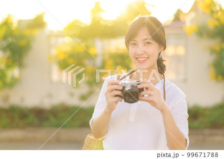Portrait of asian woman traveler using camera at street of Bangkok, Thailand. Asia summer tourism vacation concept Portrait of asian woman traveler using camera at street of Bangkok, Thailand. Asia summer tourism vacation concept 99671788