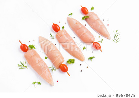 Skewers raw meat and vegetables.Top view.Raw chicken inner on skewers with tomatoes white background with spices, herbs.Raw uncooked Chicken meat,kebab on skewers.Chicken Skewers breast fillet meat. Skewers raw meat and vegetables.Top view.Raw chicken inner on skewers with tomatoes white background with spices, herbs.Raw uncooked Chicken meat,kebab on skewers.Chicken Skewers breast fillet meat. 99678478