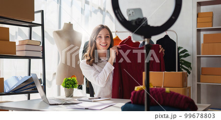 Portrait of Small Business SME owners live stream by smart phone. Online shopping concept 99678803