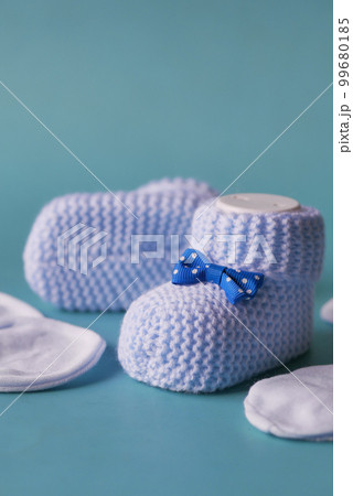 blue color Knitted shoes for an infant.  99680185