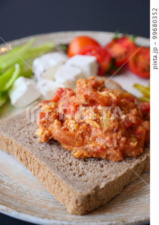 morning breakfast with Scrambled eggs on a bread on white plate morning breakfast with Scrambled eggs on a bread on white plate 99680352