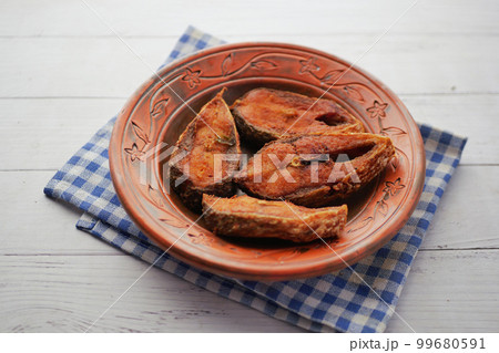 close up of cooked ilsha fish on plate on table close up of cooked ilsha fish on plate on table 99680591
