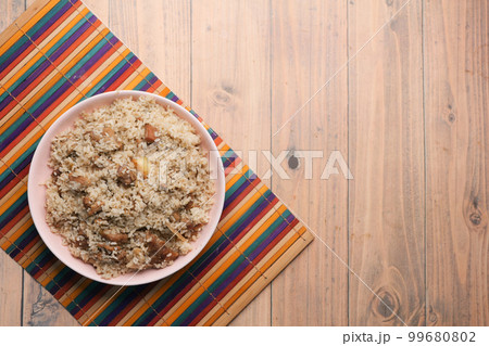 mutton biryani meal in a plate on table. 99680802