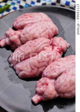 mutton brain on a chopping board  99681113