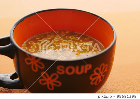 instant cup soup in a mug on table  99681398