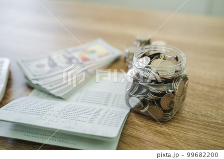 Close up of money stack coins and Dollar banknotes Saving money financial banking concept Close up of money stack coins and Dollar banknotes Saving money financial banking concept 99682200