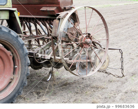 Plowed field by tractor in brown soil on open countryside nature 99683636