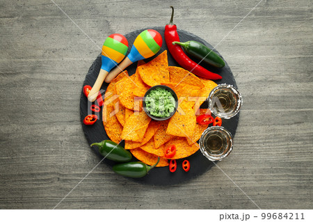 Concept of Mexico food, Tortilla and tequila, top view Concept of Mexico food, Tortilla and tequila, top view 99684211