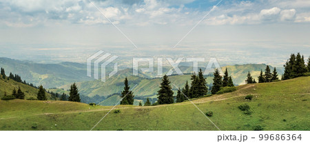 Panoramic view of the city of Almaty from the tops of the Almaty mountains. Tourist natural places of Kazakhstan, copy space 99686364