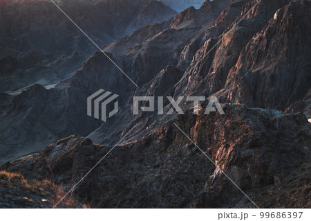 Mystical rocky background at sunrise light like mars surface. Ili gorge in Almaty region, Kazakhstan nature 99686397