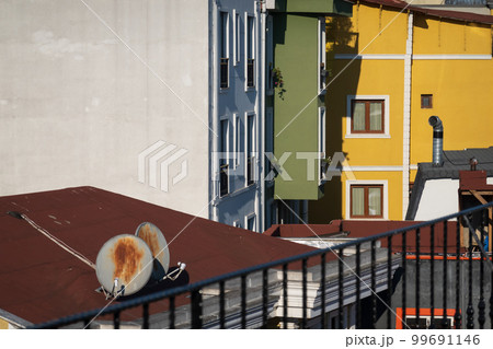Colorful buildings and roofs on street Colorful buildings and roofs on street 99691146