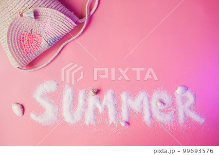 Summer text made of sand on pink background, copy space 99693576