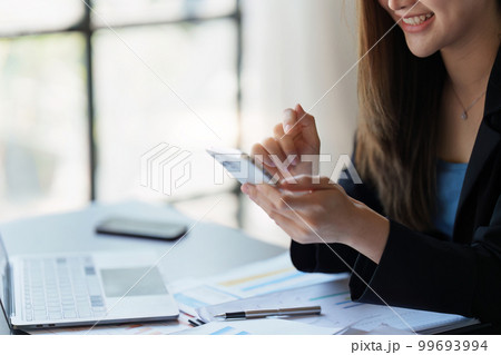 Beautiful Businesswoman completes KYC using an online banking program in order to open a digital savings account. The definition of cyber security 99693994