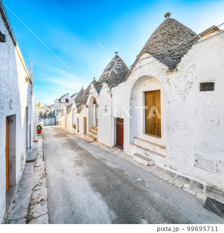 Trulli of Alberobello typical houses street view. Trulli of Alberobello typical houses street view. 99695711