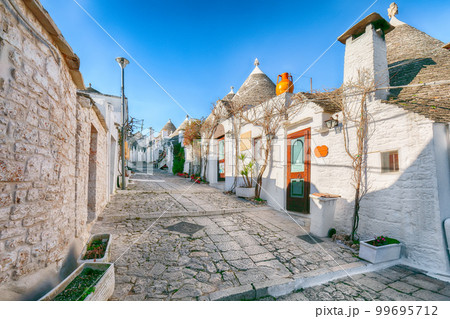 Trulli of Alberobello typical houses street view. 99695712