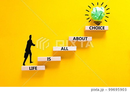 Choice and life symbol. Concept words Life is all about choice on wooden blocks. Beautiful yellow table yellow background. Businessman icon. Business choice and life concept. Copy space. 99695903