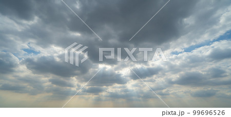 Sunset sky. Abstract nature background. Dramatic blue with orange colorful clouds in twilight time. 99696526