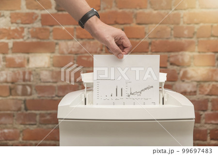 Industrial paper shredder. Paper shredder in the office, use and maintenance of professional office equipment. Industrial paper shredder. Paper shredder in the office, use and maintenance of professional office equipment. 99697483