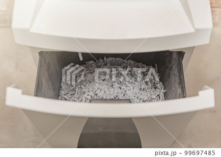 Industrial paper shredder. Paper shredder in the office, use and maintenance of professional office equipment. 99697485