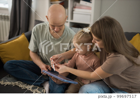 Cochlear implant system. Installation cochlear implant on child girl ear for restores hearing. Kid hears after hear return to normal Cochlear implant system. Installation cochlear implant on child girl ear for restores hearing. Kid hears after hear return to normal 99697517