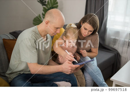 Cochlear implant system. Installation cochlear implant on child girl ear for restores hearing. Kid hears after hear return to normal 99697518