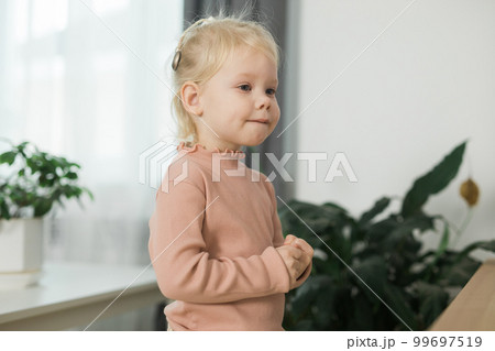 Cochlear implant system. Installation cochlear implant on child girl ear for restores hearing. Kid hears after hear return to normal, copy space and empty space for text 99697519