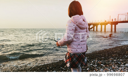 Little girl at the beach 99698807