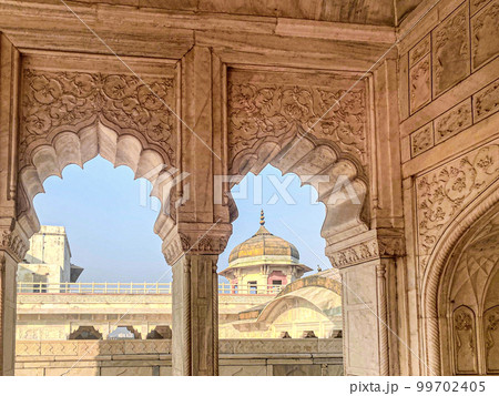 The famous red fort in the city of Agra, India. Tourists visit a popular tourist attraction. The famous red fort in the city of Agra, India. Tourists visit a popular tourist attraction. 99702405