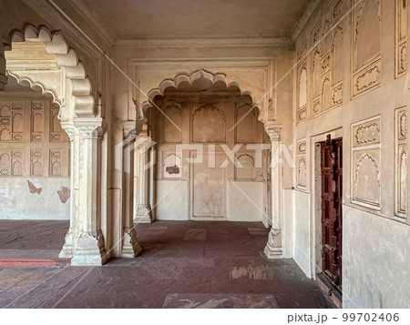 The famous red fort in the city of Agra, India. Tourists visit a popular tourist attraction. The famous red fort in the city of Agra, India. Tourists visit a popular tourist attraction. 99702406